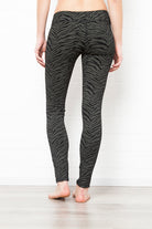 Black greenish zebra leggings medium high waist in cotton spandex shown from the back