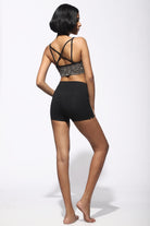 High Waist Shorts black from the back with cream black tribal cross-back bra